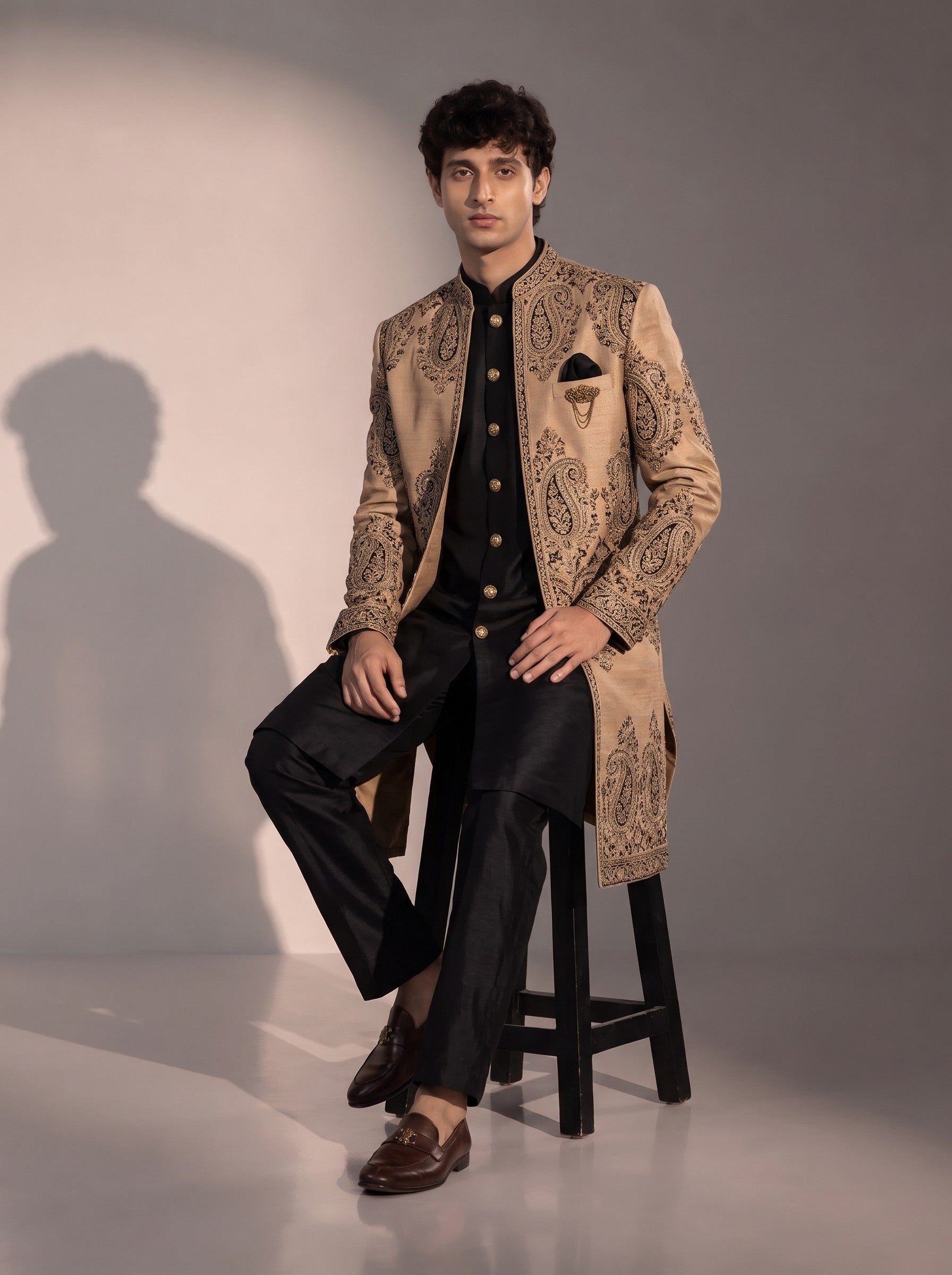 Beige and black embroidered silk indowestern for men - seated pose