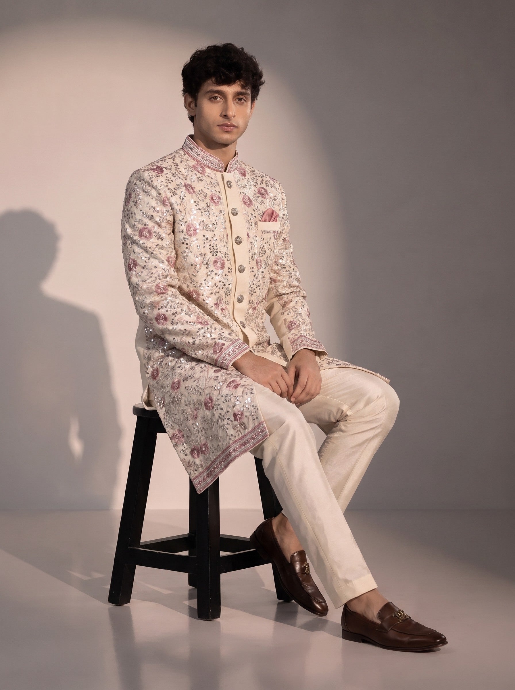 Beige floral embroidered silk indowestern for men - seated pose