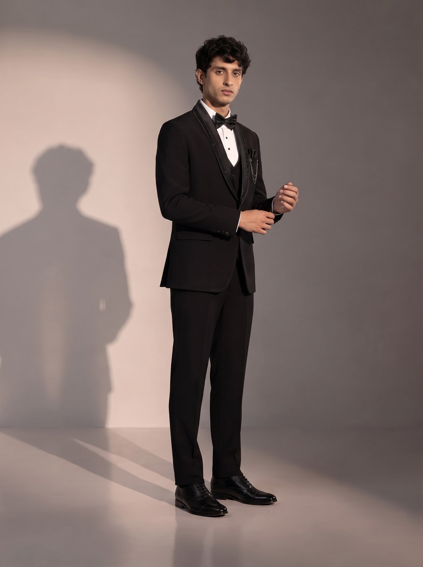 Black crystal trim tuxedo suit for men - three-quarter view