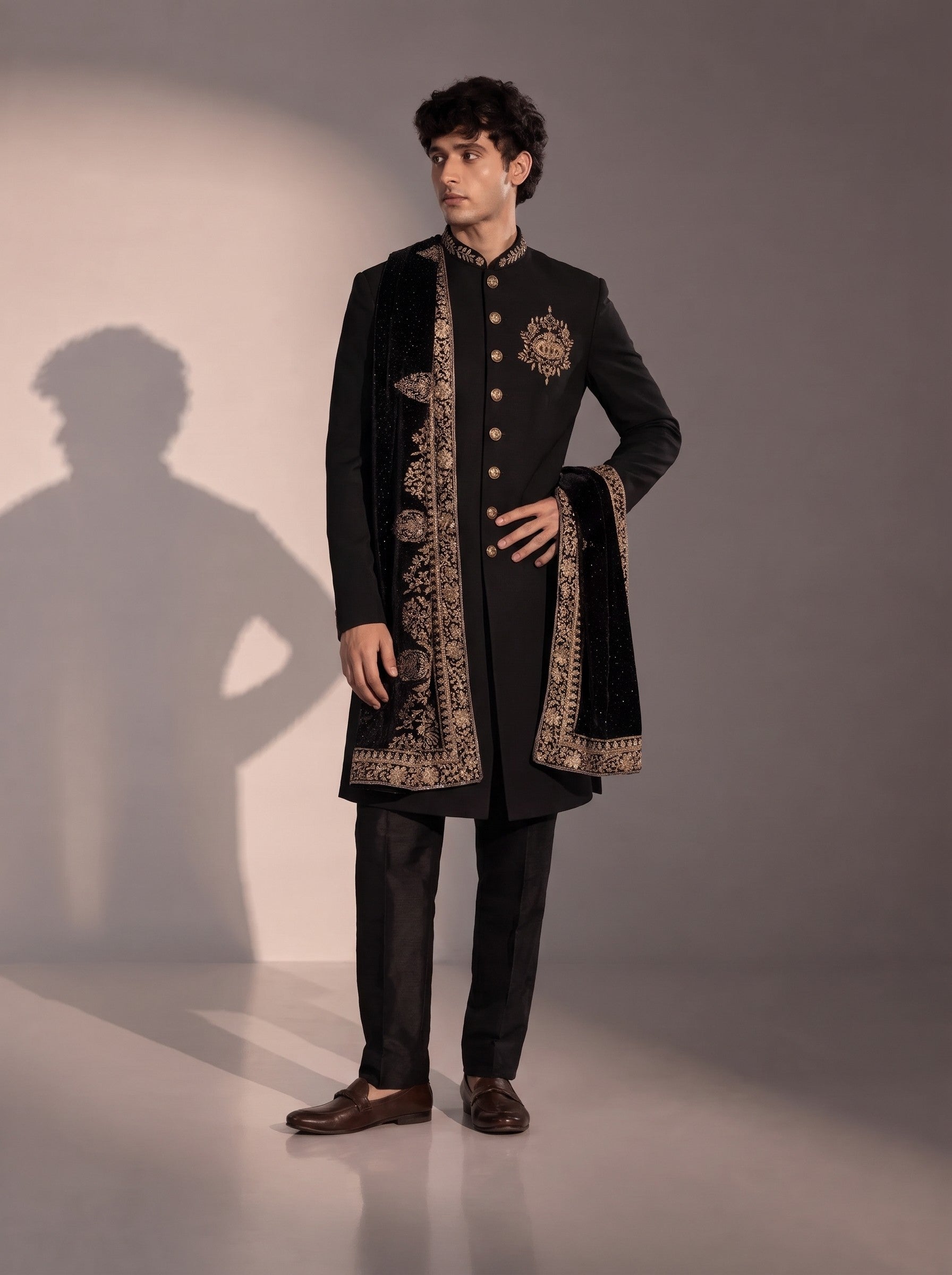 Black silk indowestern for men with gold crest embroidery and embroidered velvet stole - front view