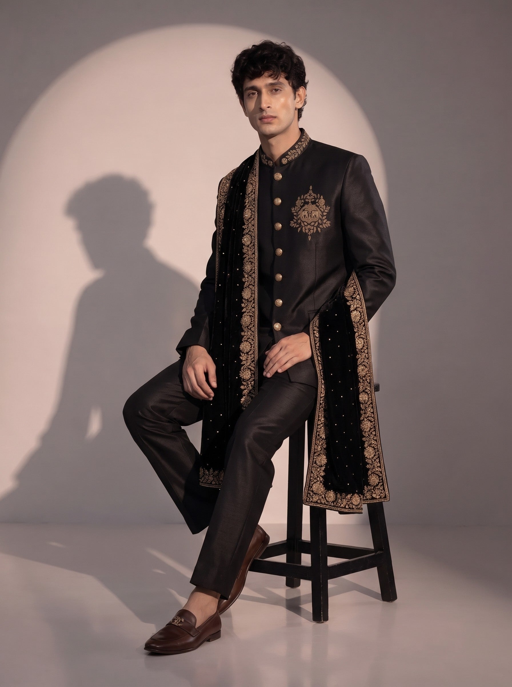 Black silk indowestern with embroidered velvet stole - seated pose
