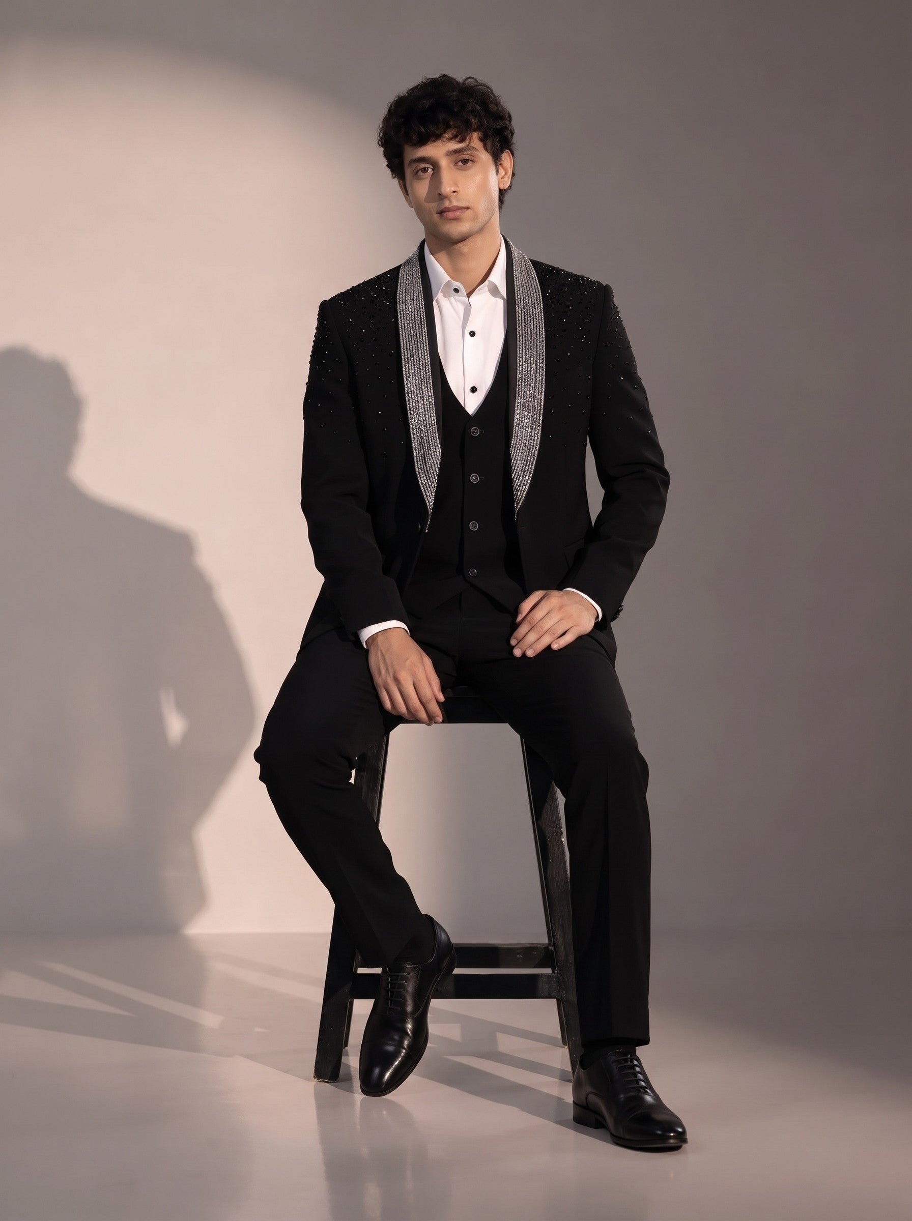 Black silver beaded suit for men - seated pose