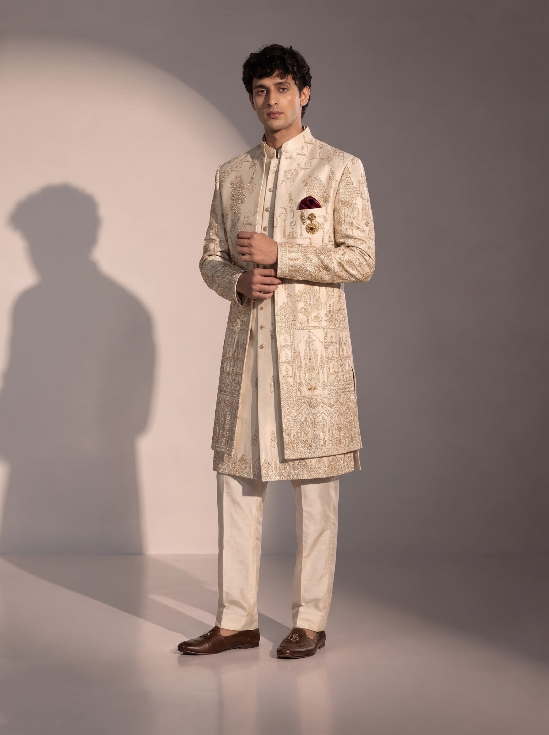 Cream Mughal embroidered silk indowestern for men - three-quarter view