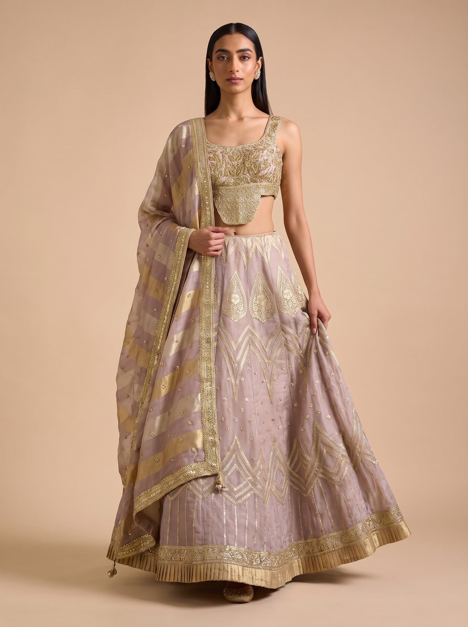 Mauve silk lehenga set showing natural skirt movement and decorative hem