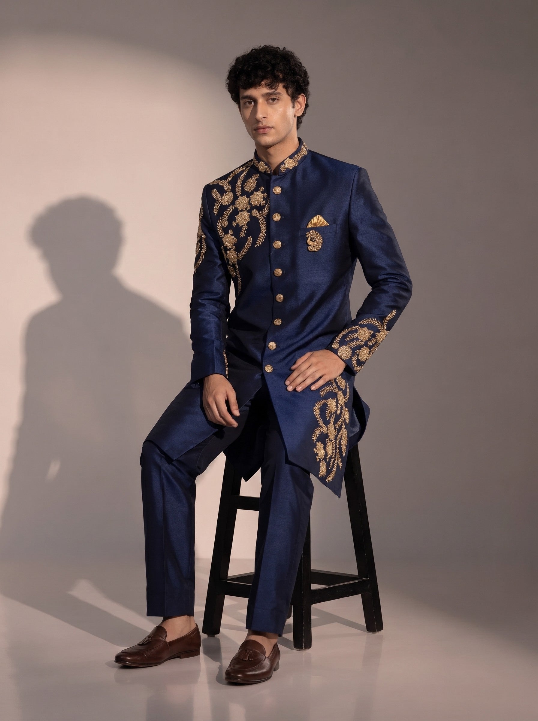 Navy blue embroidered silk indowestern for men - seated pose