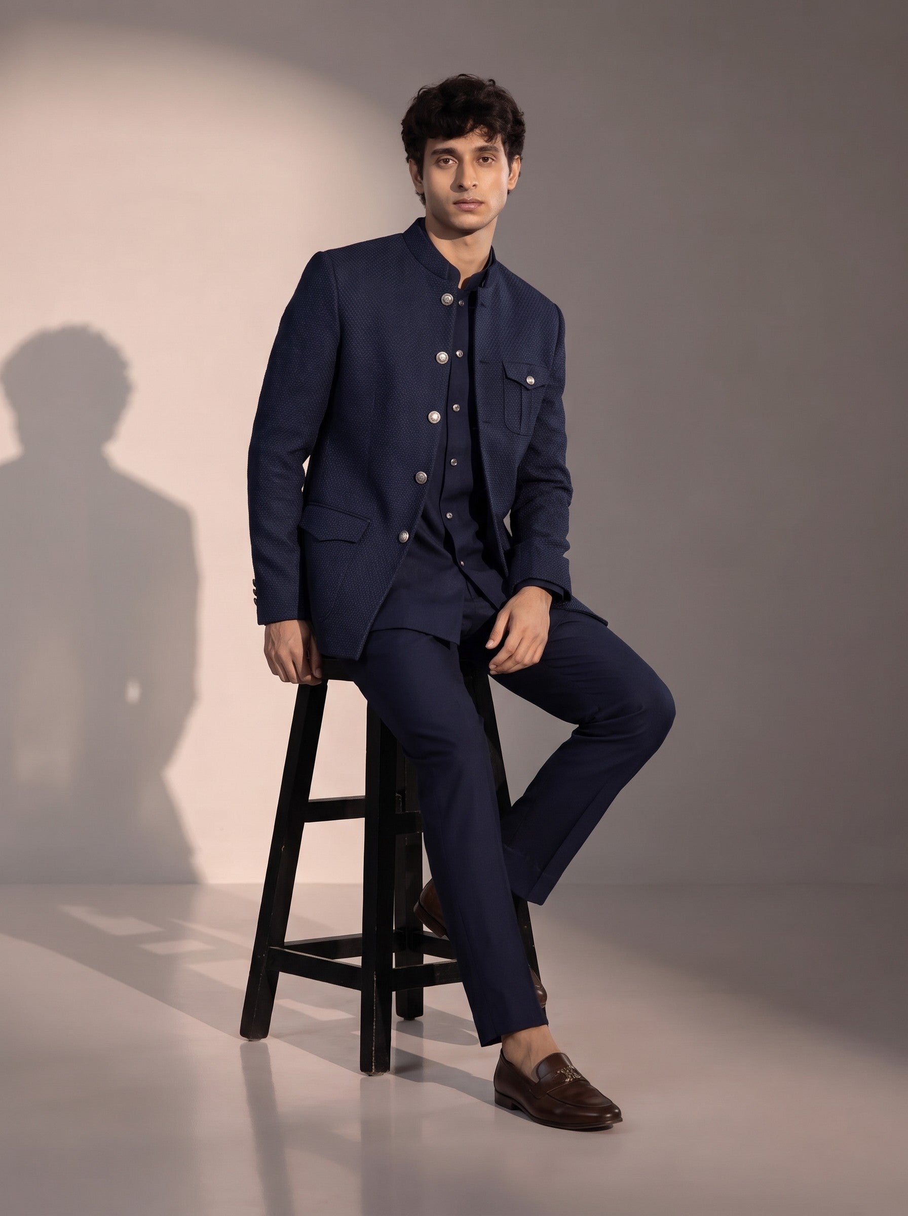 Navy blue textured jodhpuri indowestern suit for men - seated pose