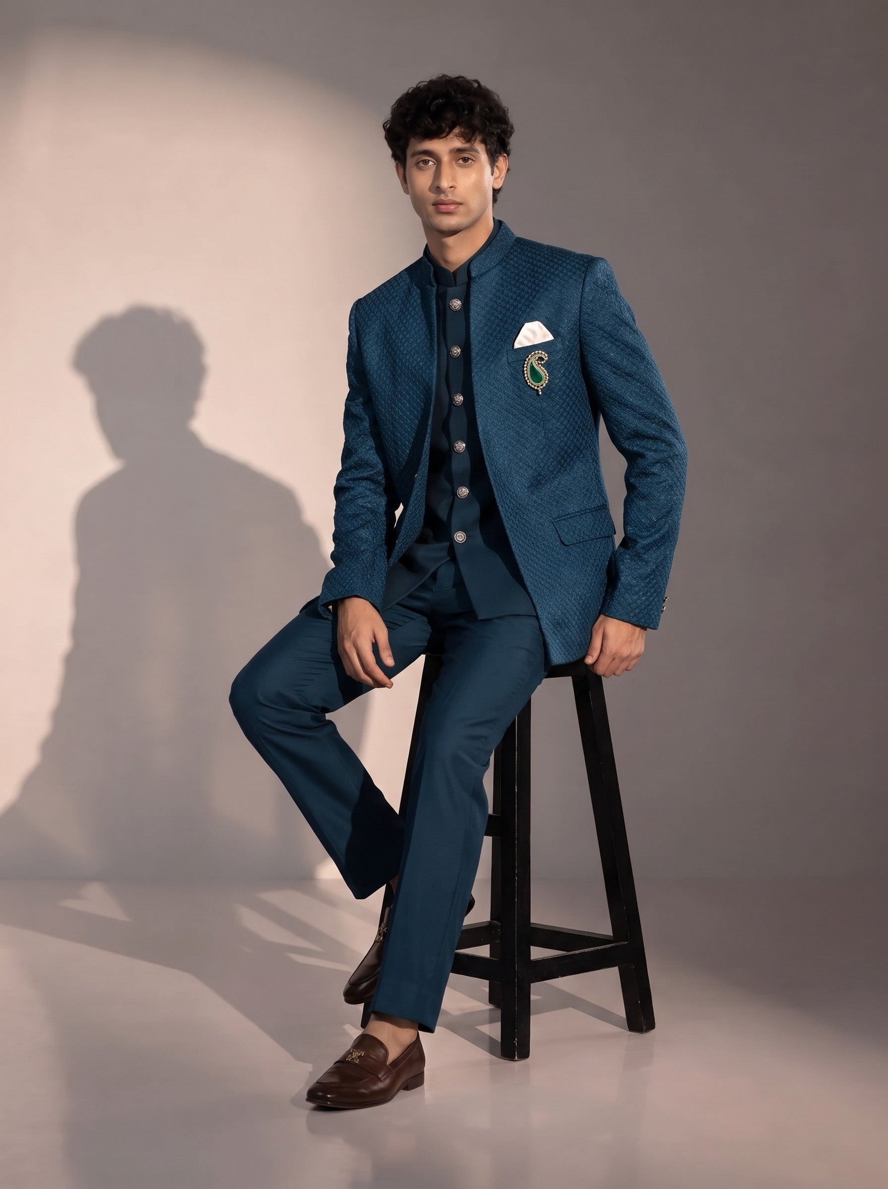 Teal blue textured jodhpuri indowestern suit for men - seated pose