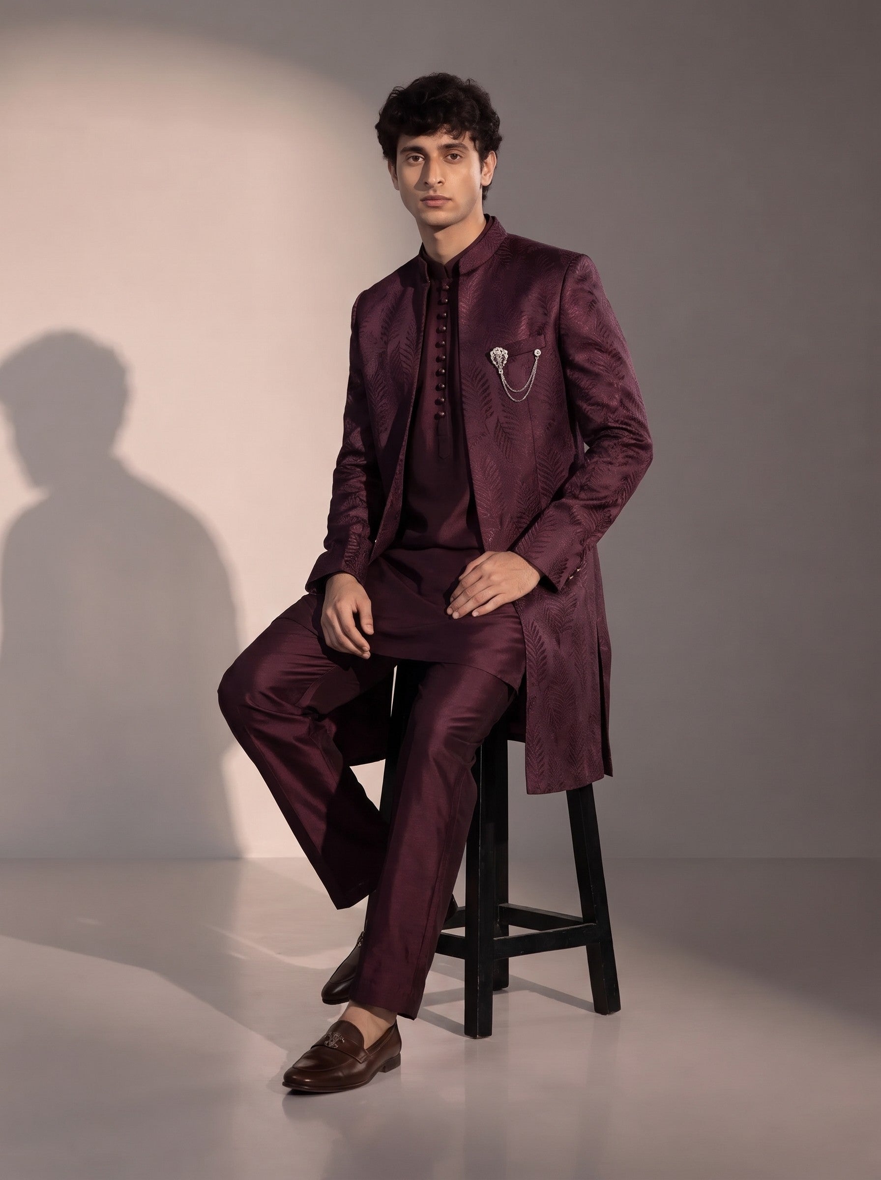 Wine jacquard silk indowestern for men - seated pose