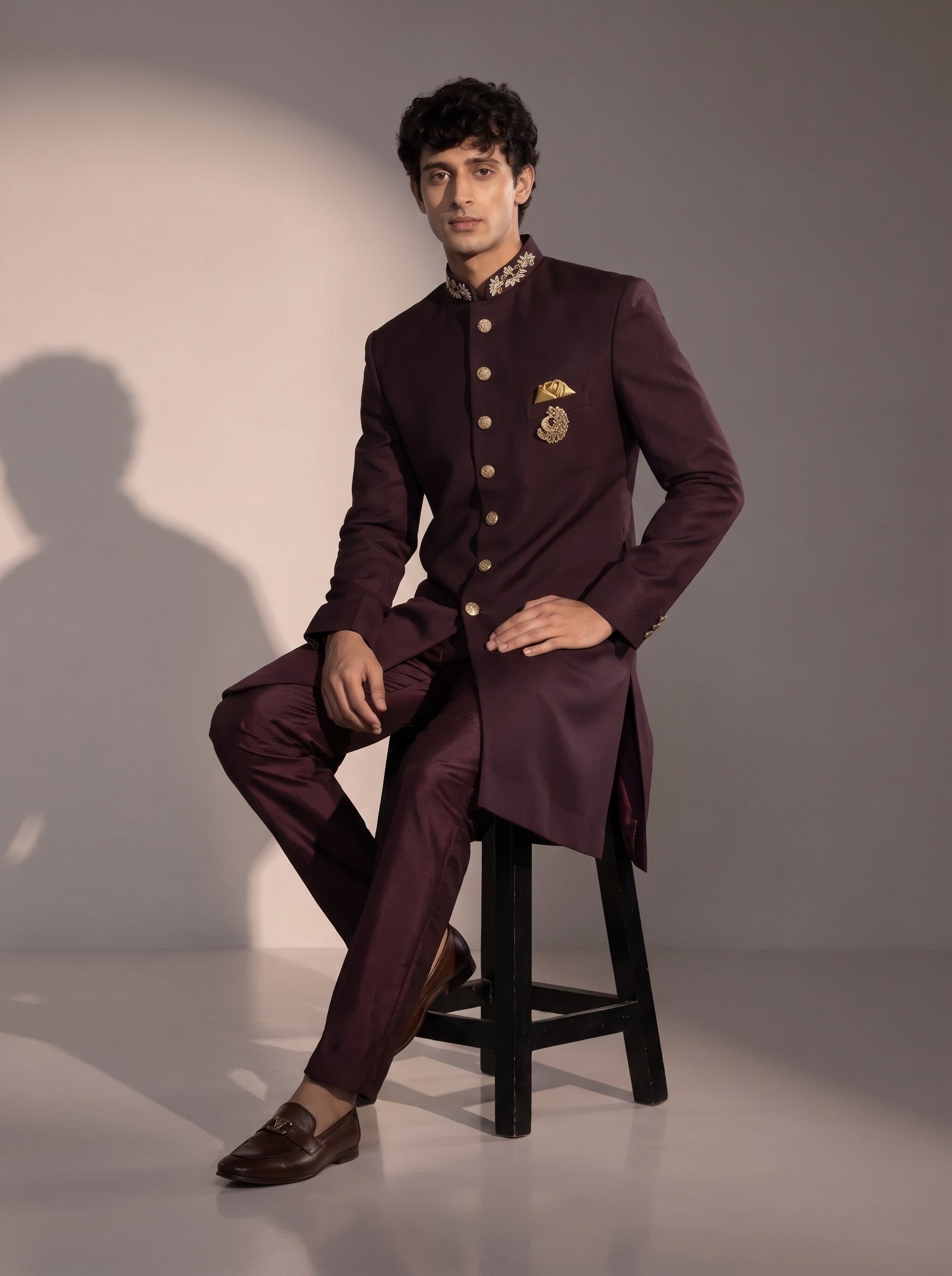 Wine silk indowestern for men - seated pose